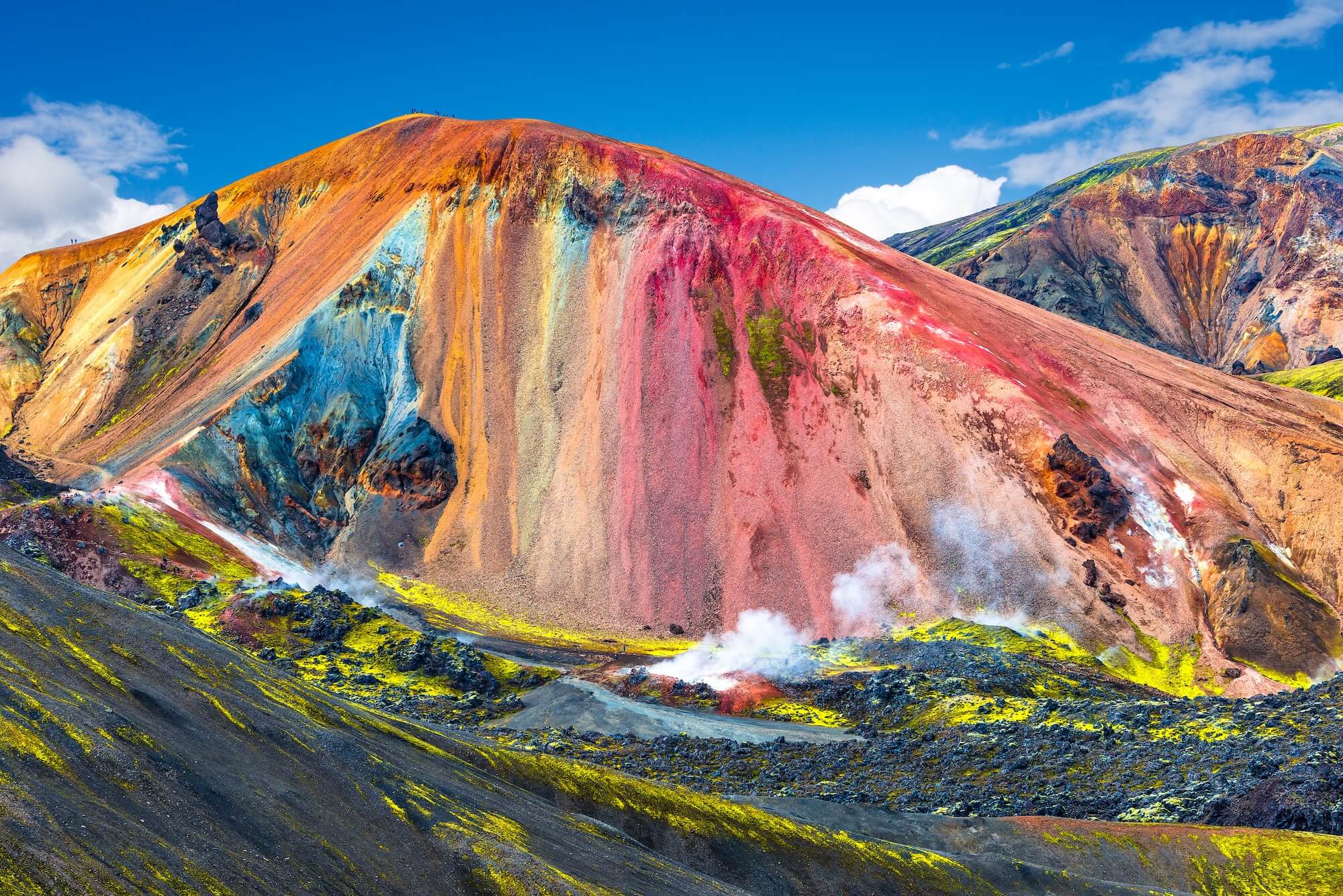 Colorful rhyolite mountains of Landmannalaugar with geothermal steam and vivid mineral hues